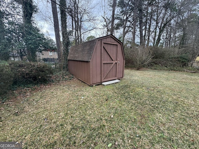 view of outdoor structure featuring a lawn