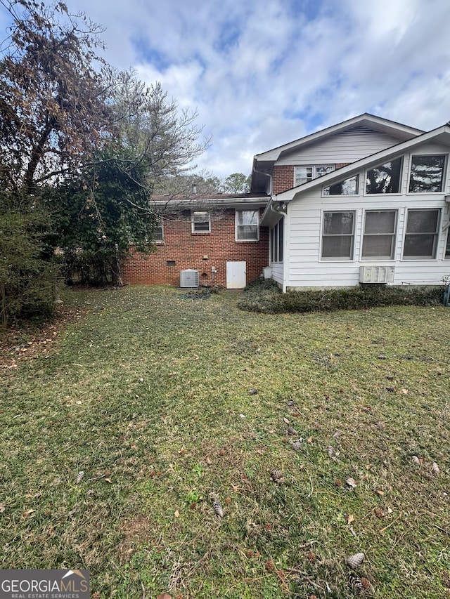 view of yard featuring central AC