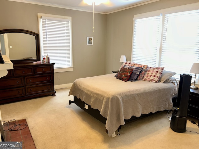 bedroom with light colored carpet and ornamental molding