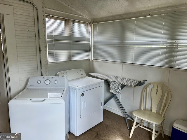 washroom with separate washer and dryer and carpet flooring