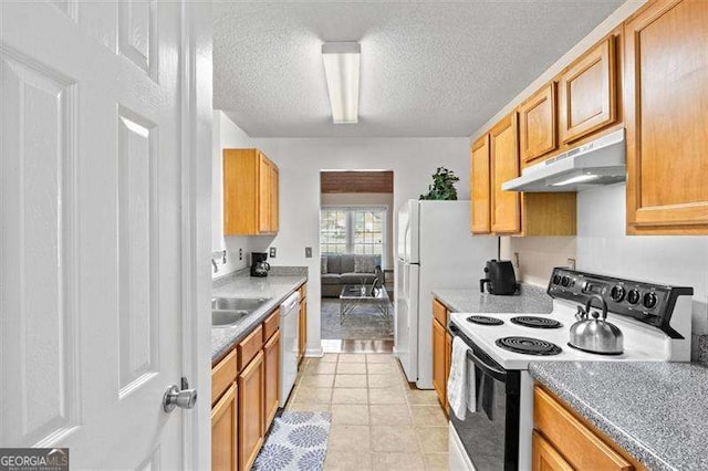 kitchen featuring electric stove, light tile patterned floors, sink, dishwasher, and a textured ceiling