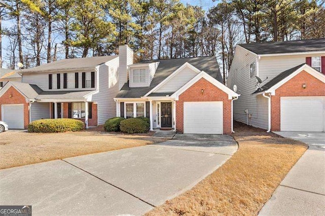 view of front property featuring a garage and a front lawn