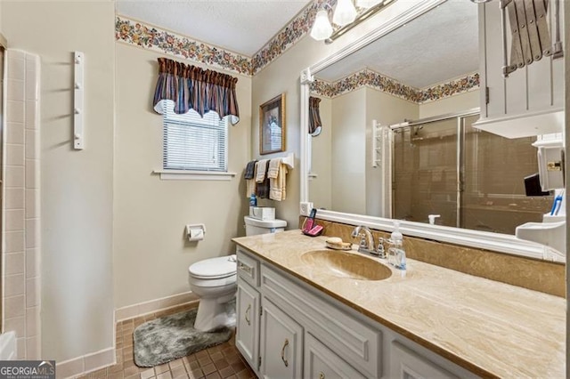 bathroom with vanity, toilet, and an enclosed shower