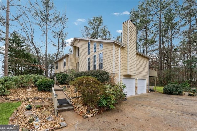 view of side of property featuring a garage