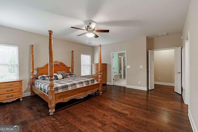 bedroom with dark wood-style floors, baseboards, visible vents, and a ceiling fan