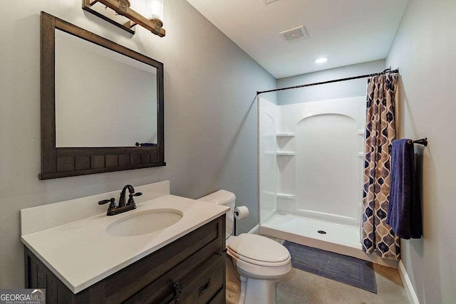 full bath with visible vents, a shower stall, toilet, and vanity