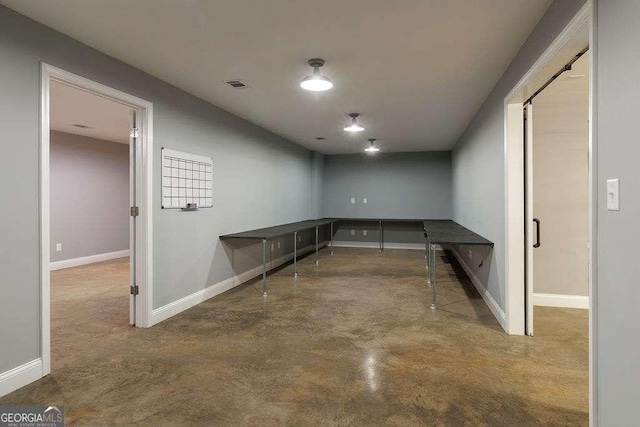 basement with visible vents and baseboards