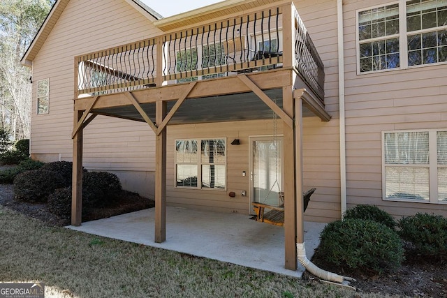 back of house featuring a patio and a balcony