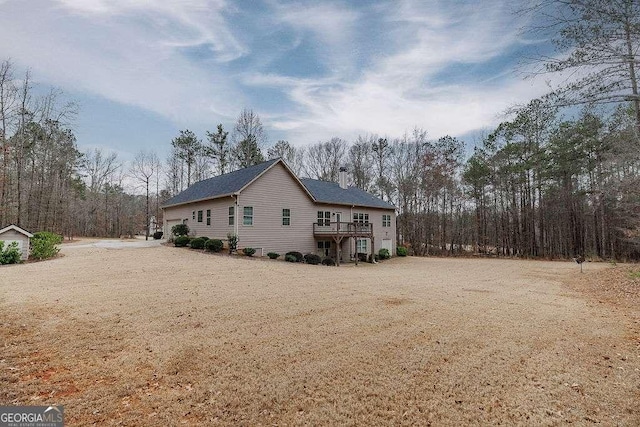 back of property featuring driveway