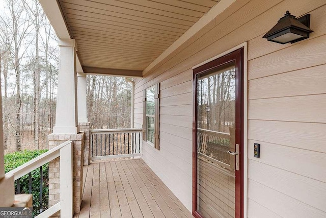 wooden terrace featuring a porch