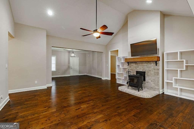 unfurnished living room featuring a ceiling fan, high vaulted ceiling, baseboards, and dark wood-style floors