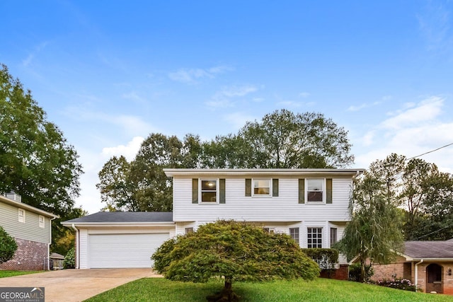 view of front of house featuring a garage and a front lawn