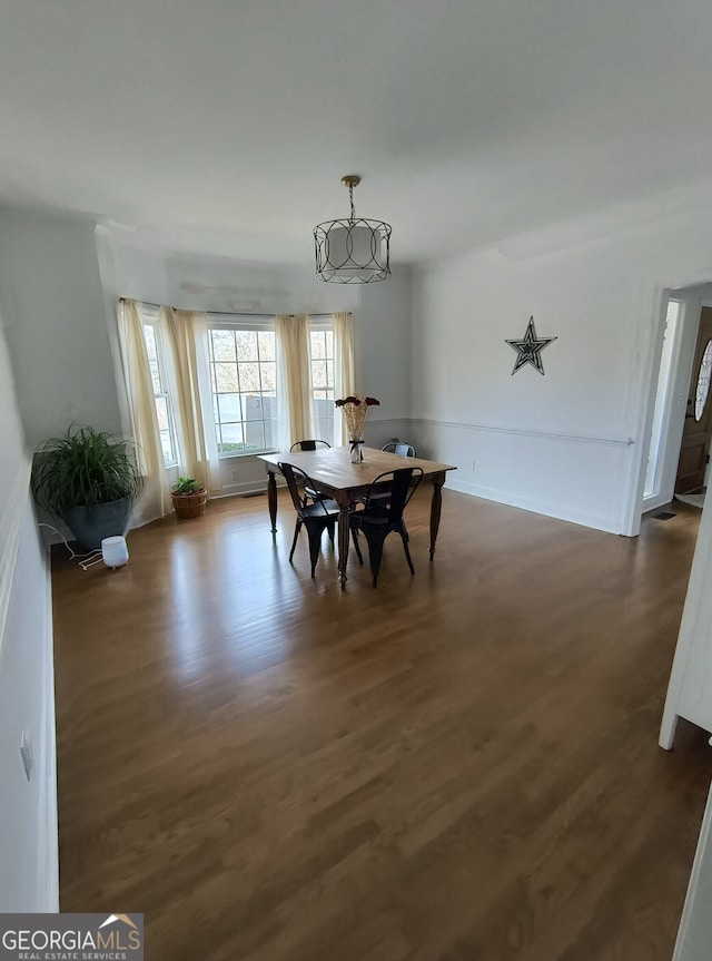 dining room featuring dark hardwood / wood-style flooring