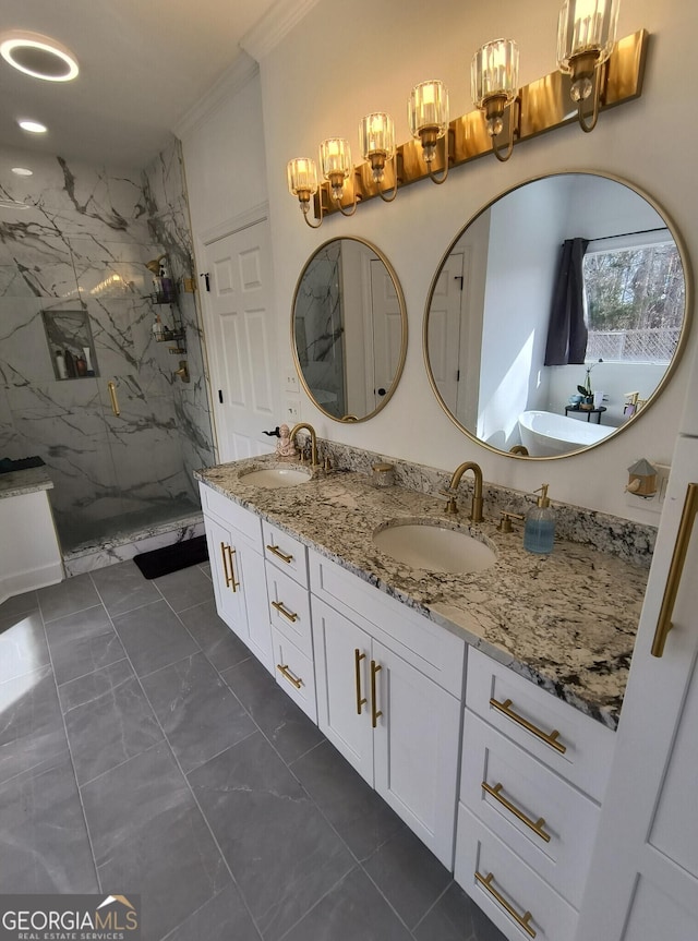 bathroom with vanity, tiled shower, and ornamental molding