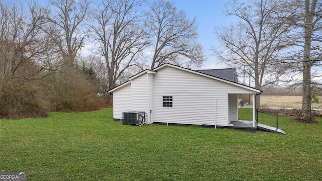 view of home's exterior featuring a yard and central air condition unit