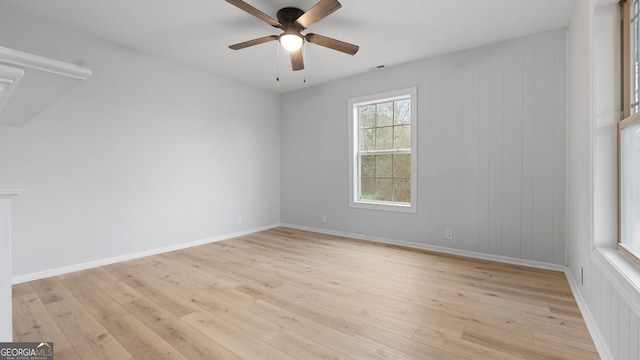 empty room featuring ceiling fan and light wood-type flooring