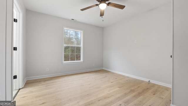 unfurnished room with ceiling fan and light wood-type flooring