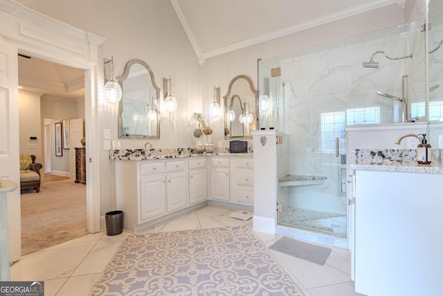 bathroom featuring crown molding, lofted ceiling, vanity, and an enclosed shower