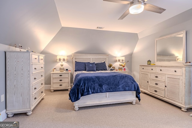 carpeted bedroom featuring lofted ceiling and ceiling fan