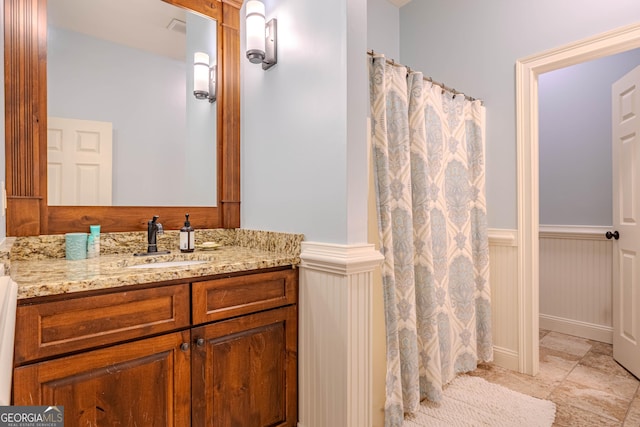 bathroom featuring vanity and a shower with shower curtain