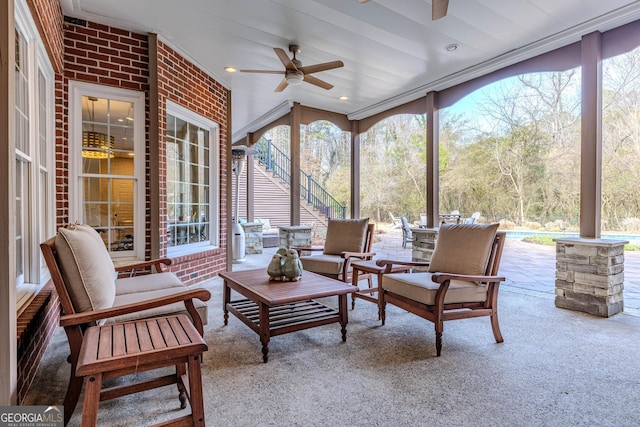 sunroom with ceiling fan