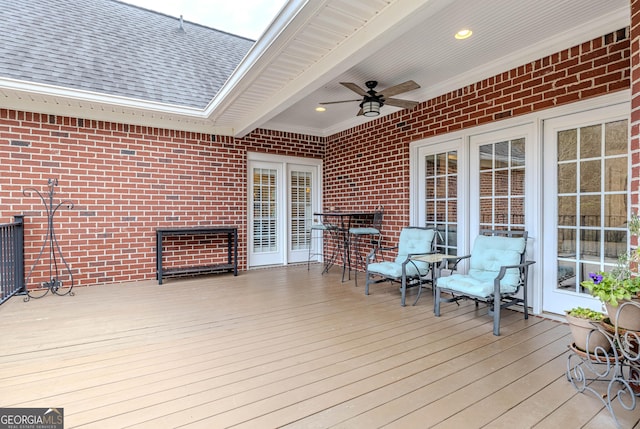 wooden terrace featuring ceiling fan