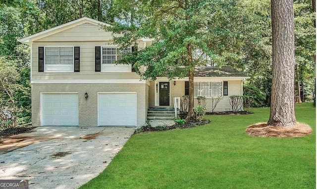 split level home with a garage and a front yard