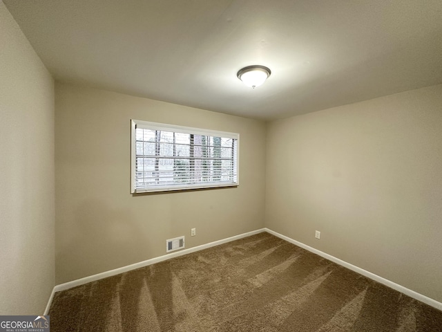 spare room with carpet flooring