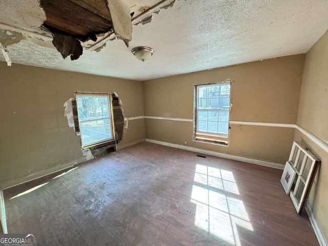 empty room with a textured ceiling