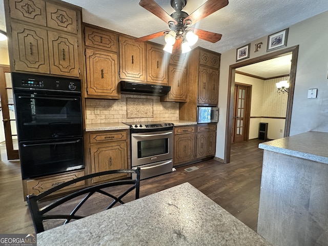 kitchen featuring backsplash, dark hardwood / wood-style flooring, ceiling fan, stainless steel appliances, and a textured ceiling