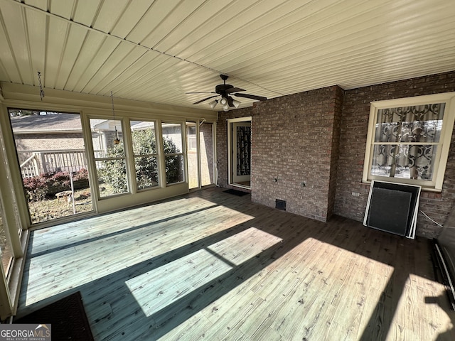 wooden deck featuring ceiling fan