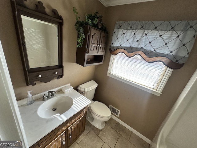 bathroom featuring tile patterned flooring, vanity, and toilet