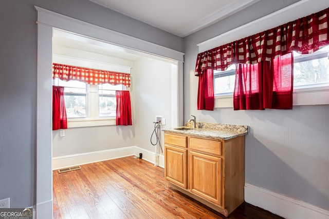 bathroom featuring vanity and wood-type flooring