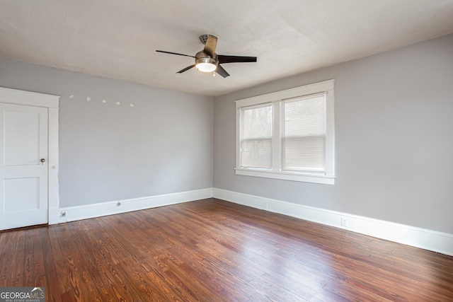 empty room featuring hardwood / wood-style floors and ceiling fan