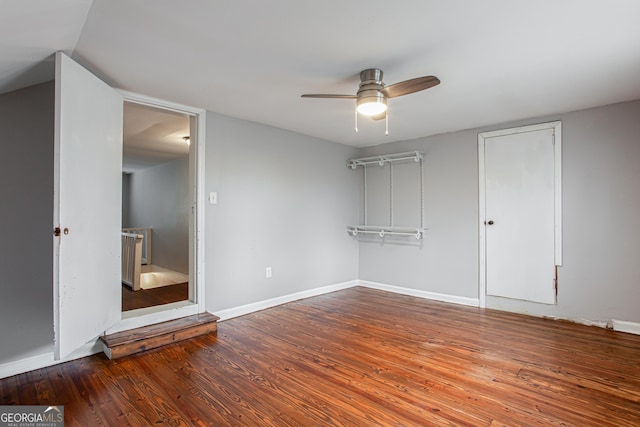 unfurnished bedroom featuring hardwood / wood-style floors and ceiling fan