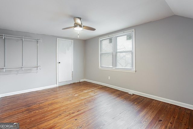 unfurnished bedroom with lofted ceiling, wood-type flooring, and ceiling fan