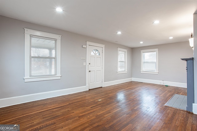 entryway with dark hardwood / wood-style floors