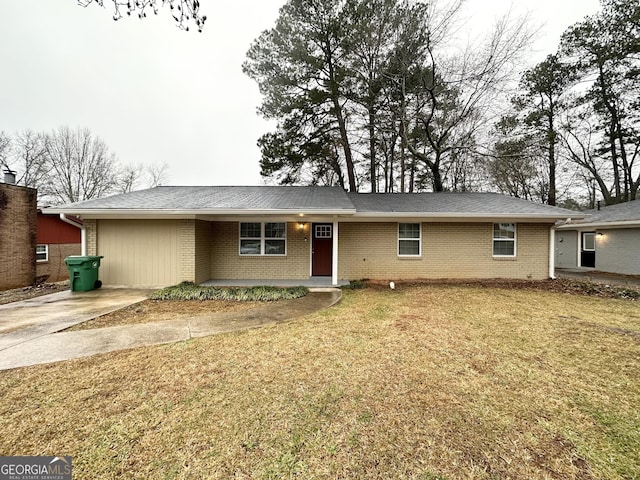 ranch-style home with a front lawn