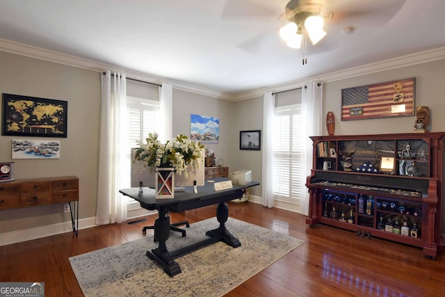 office with ceiling fan, ornamental molding, and dark hardwood / wood-style flooring