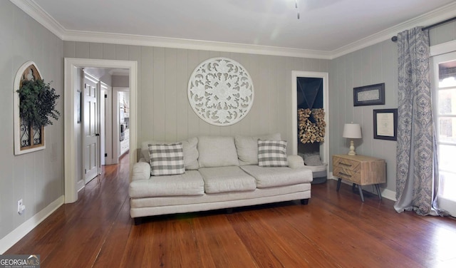 living room with crown molding and dark wood-type flooring