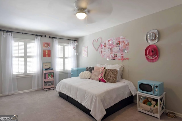 bedroom with light carpet and ceiling fan