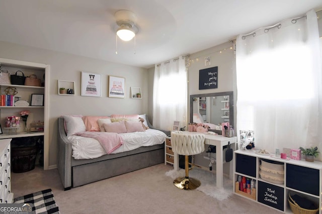 carpeted bedroom featuring ceiling fan