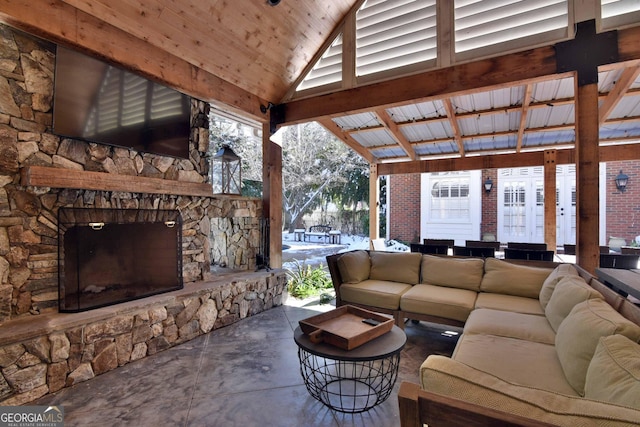 view of patio / terrace with a gazebo and an outdoor living space with a fireplace