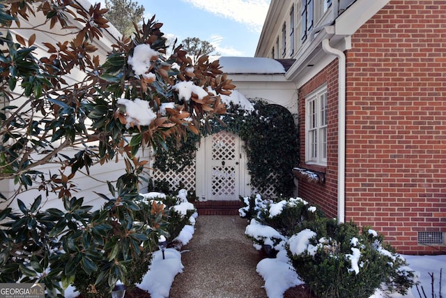 view of snow covered property