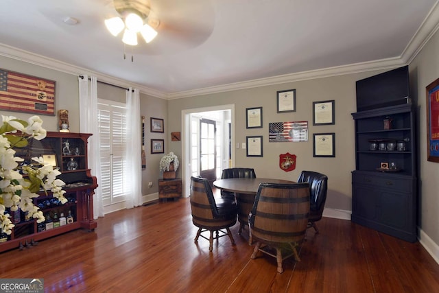 dining area featuring crown molding and dark hardwood / wood-style flooring