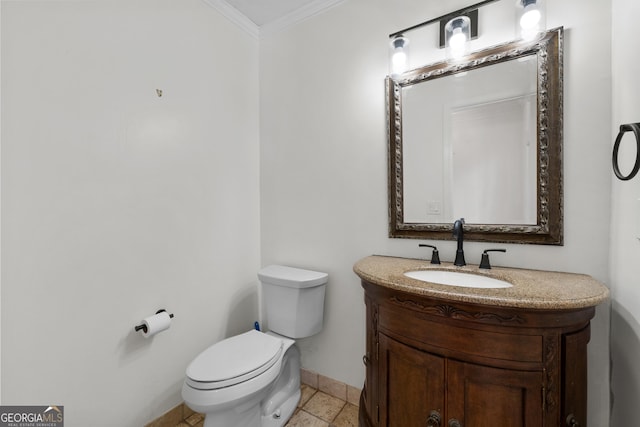 bathroom featuring ornamental molding, vanity, and toilet