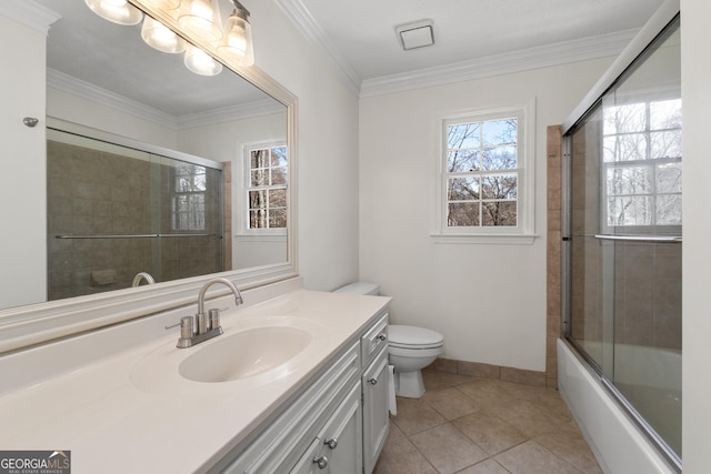 full bathroom with tile patterned floors, toilet, ornamental molding, vanity, and enclosed tub / shower combo