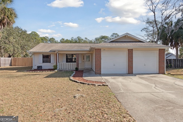 ranch-style house with a porch, a garage, and a front lawn