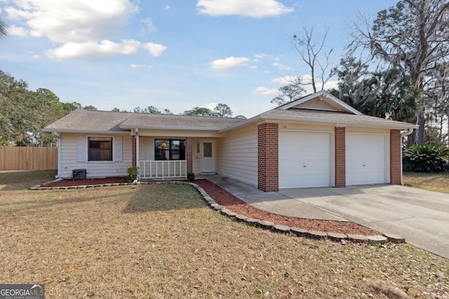 ranch-style house featuring a garage, a porch, and a front yard