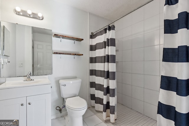 bathroom with curtained shower, vanity, toilet, tile patterned floors, and a textured ceiling